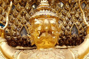 Golden Garua statue half body and blur native Thai style art backgound.