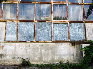 Old concrete wall and rusty windows
