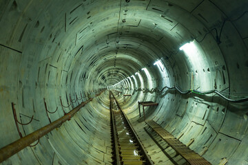 Soft focus of Underground tunnel construction. Transport pipeline by Tunnel Boring Machine for...