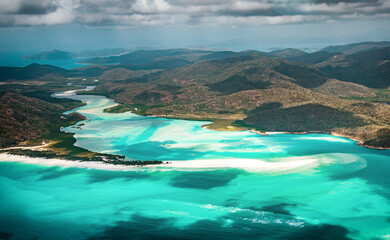 Fototapeta na wymiar The aerial view of the Whitheaven Beach and Whitsunday Island from scenic helicopter