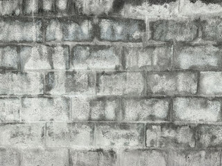 Background and surface of poorly constructed concrete block walls.
