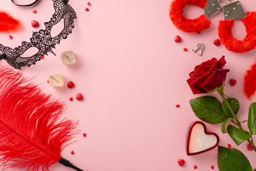 Fotobehang Embrace passion with adult boutique finds. Top view intimate essentials—lace mask, dice game, furry handcuffs, feather tickler, red rose, candle, sprinkles on soft pink backdrop, text-friendly space © ActionGP
