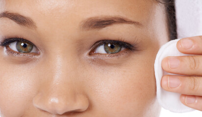 Woman portrait, cotton pad and closeup for skin care, beauty and cosmetics product with dermatology results in studio. Face of person or model eyes with hygiene wipe for makeup on a white background © Mapodile M./peopleimages.com