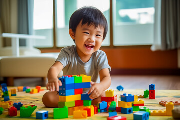 Kid boy playing with building blocks at home or kindergarten. Educational and creative toys and games for young children. Baby in white bedroom with rainbow bricks. 