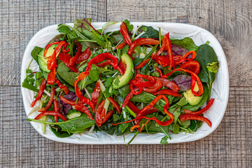 A high angle view of a vibrant red and green salad ready to eat