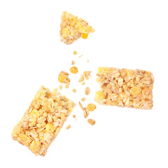 Granola bar breaking in air on white background