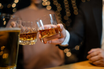 Barman pouring whiskey whiskey glass..