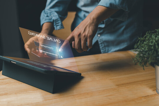 SHORTLISTbanking.Businessman using tablet to unlock and access to business banking data network. Biometric identification and cyber security protect business transaction from online digital banking.