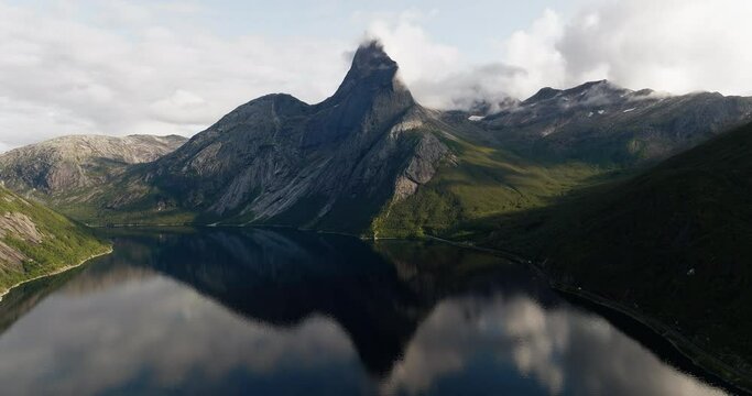 Epic reflection in Tysfjord of iconic Stetind mountain, Norway National Mountain