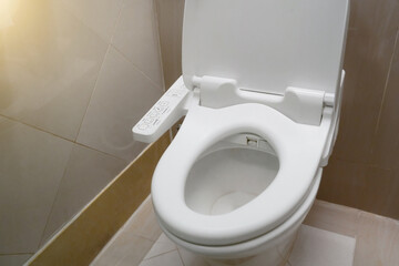 High Tech toilet with automatic bidet installed in public restroom