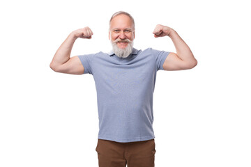 a handsome elderly man with a gray beard and mustache in a T-shirt is full of energy and health