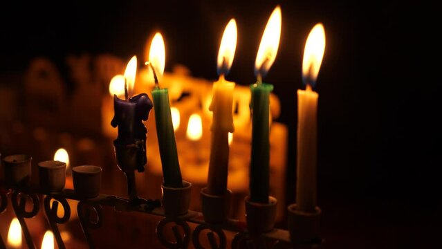 Forth night of Hanukka marked by the four lit candles and shamash in the menorah