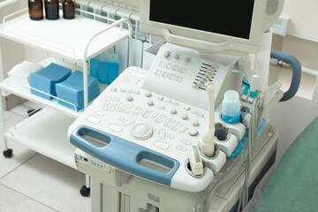 Ultrasound machine and medical trolley in hospital, closeup