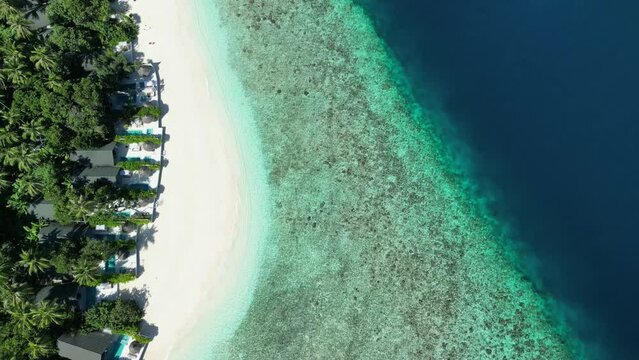 Tropical Island Paradise - Malahini Kuda Bandos, Maldives: Aerial drone full island beach and reef from above
