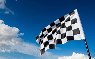Foto op Canvas Checkered flag on blue sky © xy