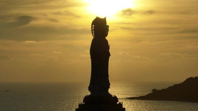 Aerial footage of Guanyin statue at seaside in nanshan temple, hainan island , China