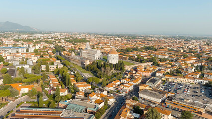 Pisa, Italy. The famous Leaning Tower and Pisa Cathedral in Piazza dei Miracoli. Summer. Evening hours, Aerial View