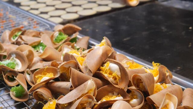 Making Khanom Buang (Thai crispy pancakes or crispy crepes), Traditional Thai snack