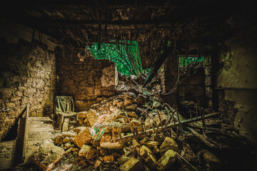 The rotten old house with a missing wall.