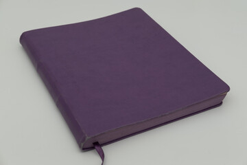 Purple notebook on a white background