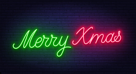 Merry Xmas neon lettering on brick wall background.
