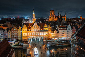 Fototapeta na wymiar Gdansk, Poland - December 14, 2023: Christmas illuminations on the historic center of Gdansk at night, Poland.