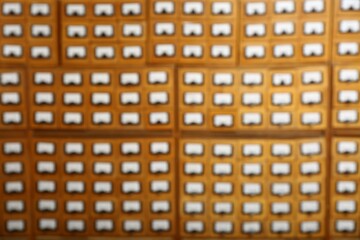 Blurred view of library card catalog drawers as background