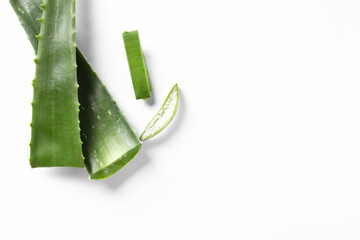 Cut aloe vera plant on white background, flat lay. Space for text