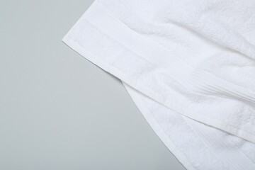White terry towel on light grey background, top view. Space for text - obrazy, fototapety, plakaty