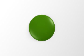 Green colored glossy round badge or button on white background for graphic design.