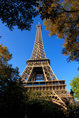 Closeup of the Eiffel tower of Paris in France on the blue sky background