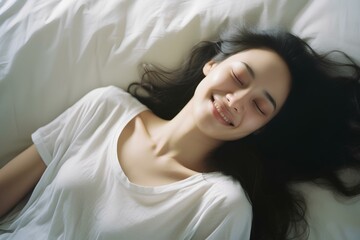 A beautiful asian woman lying in a soft and comfortable bed and sleeping happily. generative AI - Powered by Adobe