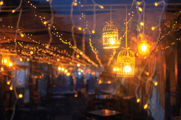 View of the Christmas tent lights through the transparent polyethylene wall. Background