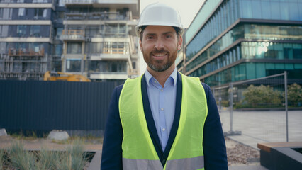 City urban building construction industry work Caucasian middle-aged adult man worker in hardhat...