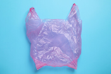 One plastic bag on light blue background, top view