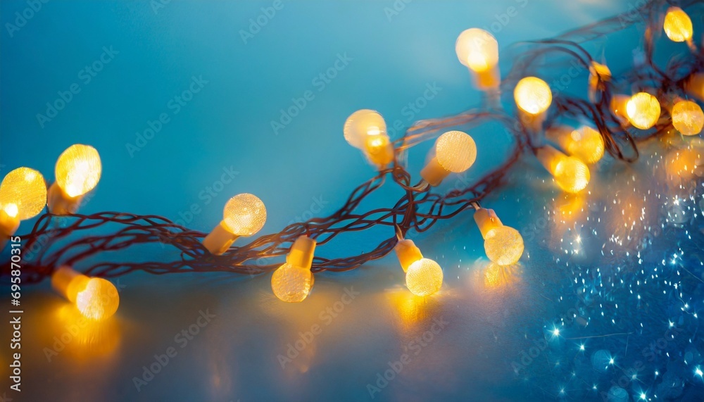 Wall mural christmas garland bokeh lights over blue background minimalist holiday illumination ai generated