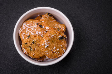 Delicious sweet round sponge cookies sprinkled with coconut flakes