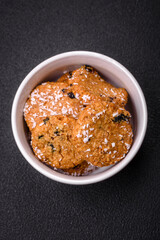 Delicious sweet round sponge cookies sprinkled with coconut flakes