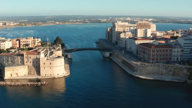 Overview of Taranto at dawn, with Aragonese Castle, swing bridge, old town, Mar Piccolo
