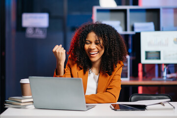 Business woman are delighted and happy with the work they do on their tablet, laptop at office....