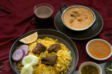Muslim food including beef  biryani, masala curry is placed on the table, view from above