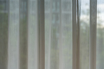 White transparent curtains in the empty room, decorative curtain on window