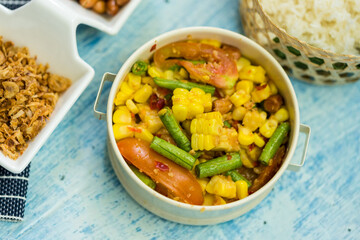 Spicy papaya salad with boiled corn, represent thai cuisine and food related concept idea.