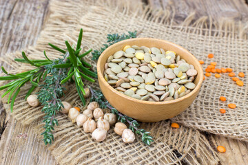 Fototapeta na wymiar lentils, chickpeas and fresh herbs