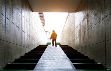 Men walking on the stairs of the underground