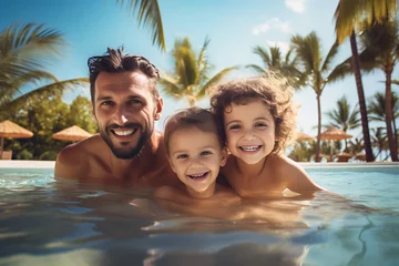 Foto op Plexiglas happy dad with his children swimming in the pool on a summer day on vacation at the resort © Marina Shvedak
