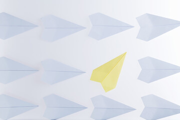 Yellow origami plane stand out from the crowd