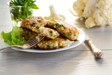 cooked vegetarian fried cauliflower cutlets in a plate