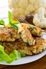 cooked vegetarian fried cauliflower cutlets in a plate