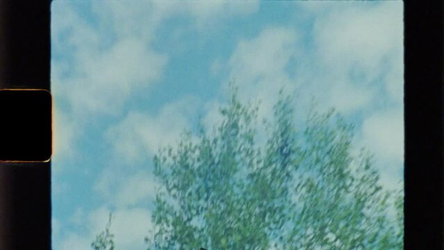 Blue sky with clouds. Shot on 8mm camera